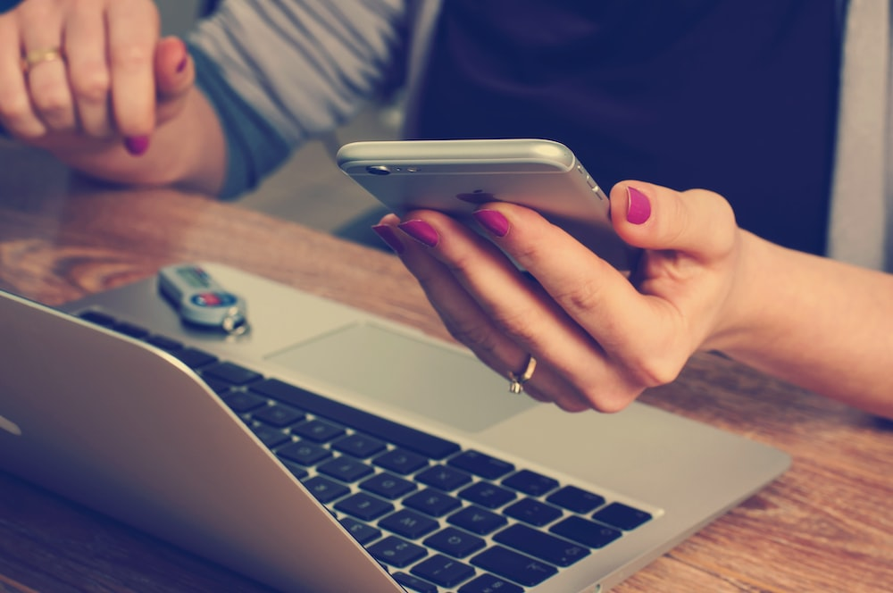 A woman using her phone.